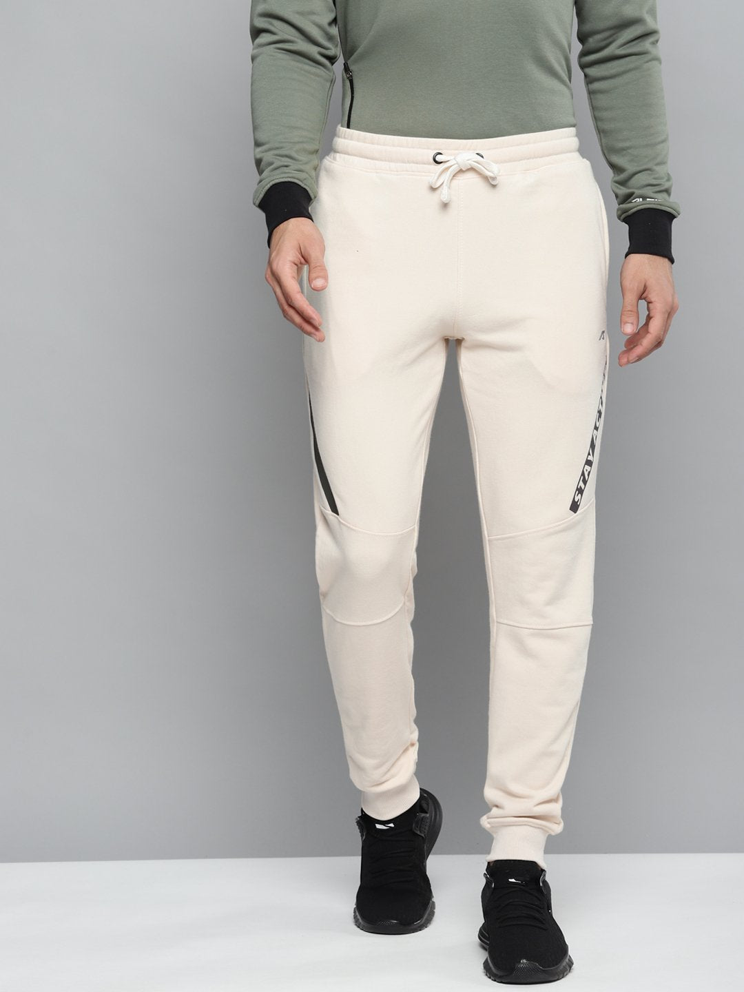 Alcis Men Off-White Solid Slim Fit Joggers with Printed Detail