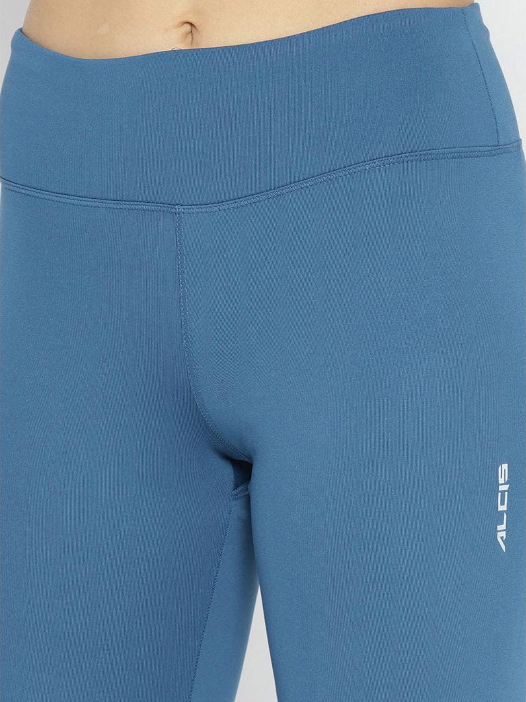Alcis Women Teal Blue Solid Running Tights with Printed Detail